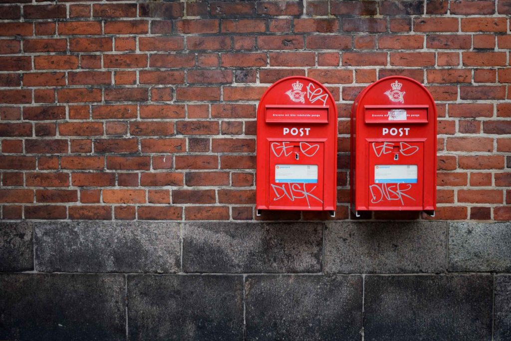 Two postboxes attached to a wall